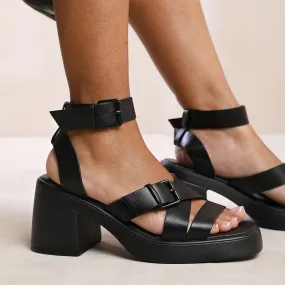 TEREZA MID HIGH BLOCK HEEL SANDALS WITH BUCKLE DETAIL IN BLACK FAUX LEATHER